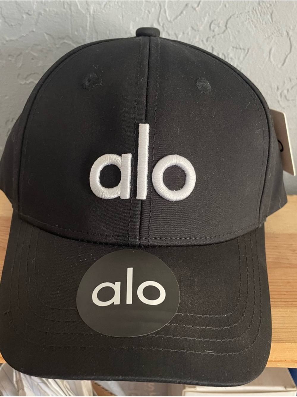 ALO Yoga Black Cap with White Logo Trim